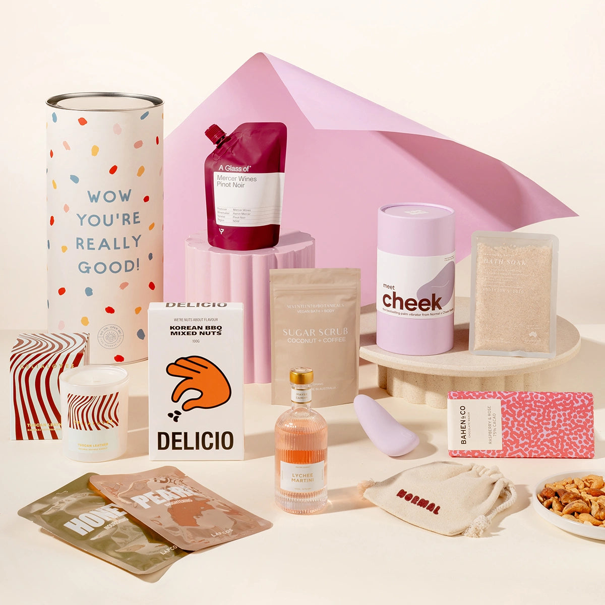 Pamper hamper with a vibrator sex toy, wine, mixed nutes, candle, face masks, lychee martini, chocolate, body scrub and body soak. Packaged in a designed canister.