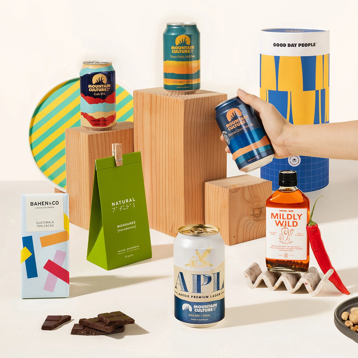 Craft beer gift hamper with 4 cans of Mountain Culture beer, burleigh chilli sauce, macadamias and organic chocolate. Packaged in a cool canister.