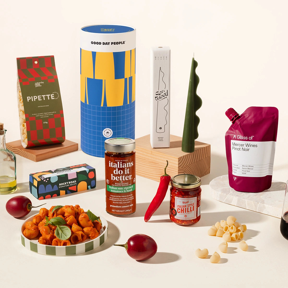 Mamma Mia gift hamper with gourmet food products such as pipette pasta, pasta sauce, italian style chilli, rocky road, wine and a sculptural candle.