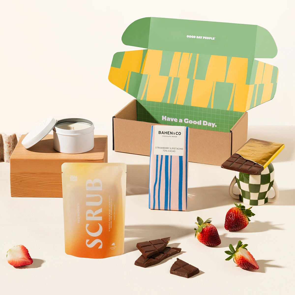 Pamper penny gift box with organic chocolate, a scented candle and body scrub