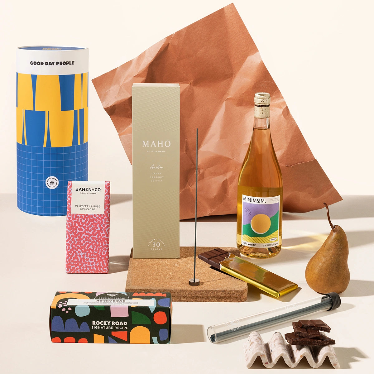 Pamper gift hamper with an incense burner kit, wine, chocolate, rocky road. Packaged in a sleek, designed canister.
