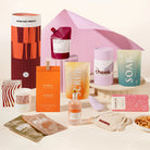 Pamper hamper with a vibrator sex toy, wine, mixed nutes, candle, face masks, lychee martini, chocolate, body scrub and body soak. Packaged in a designed canister. 