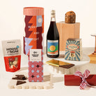 A curated Christmas gift hamper containing your choice of wine, panettone, chocolate and mixed chocolate coated nuts