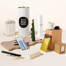 Cosy claire gift hamper. Pamper hamper set with a clay mask set (brush and ceramic holder included), decorative pillar candle, organic chocolate and ceramic cup.