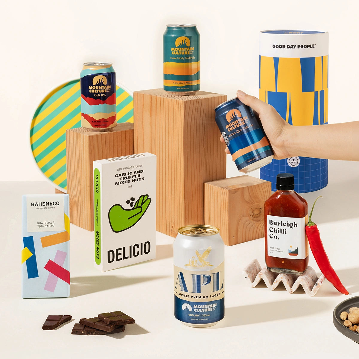 Craft beer gift hamper with 4 cans of Mountain Culture beer, burleigh chilli sauce, Garlic & truffle mixed nuts and organic chocolate. Packaged in a cool canister. 