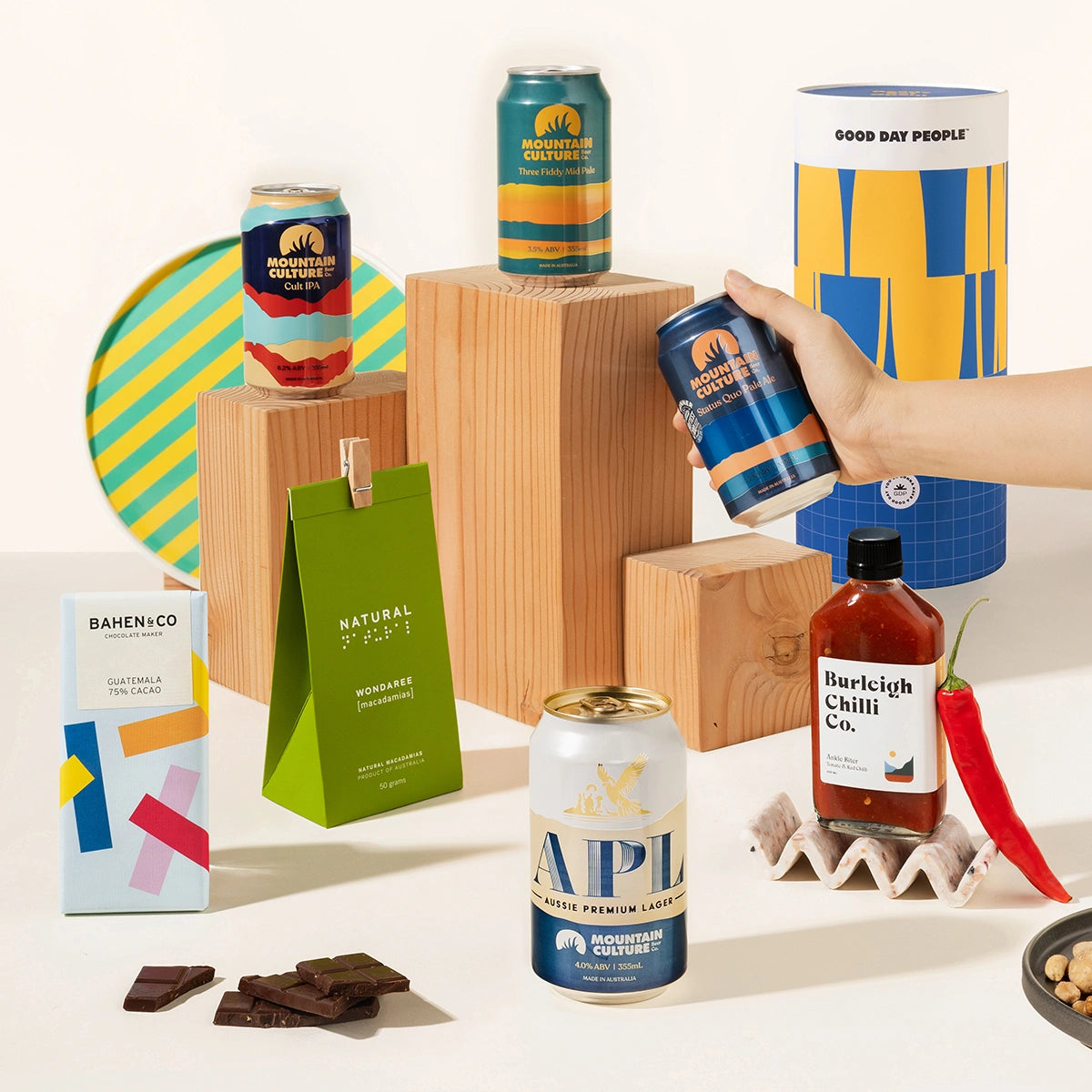 Craft beer gift hamper with 4 cans of Mountain Culture beer, burleigh chilli sauce, macadamias and organic chocolate. Packaged in a cool canister. 