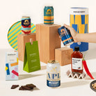 Craft beer gift hamper with 4 cans of Mountain Culture beer, burleigh chilli sauce, macadamias and organic chocolate. Packaged in a cool canister. 