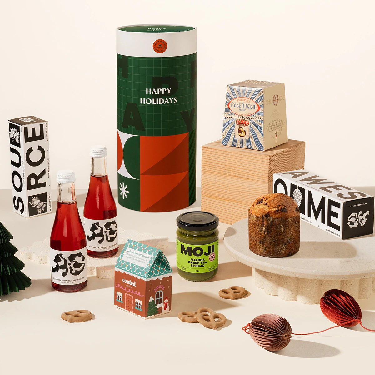 Elfie Ellie Christmas Gift Hamper with 2 bottles of non-alc red grape pepperberry cocktails, matcha spread, Italian panettone and salted coated pretzels. Australian artisanal treats.