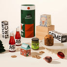Elfie Ellie Christmas Gift Hamper with 2 bottles of non-alc red grape pepperberry cocktails, matcha spread, Italian panettone and salted coated pretzels. Australian artisanal treats.