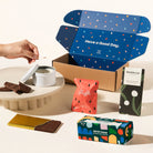 Gifting Gail gift box with a candle, fancy fairy floss, a chocolate block & rocky road.