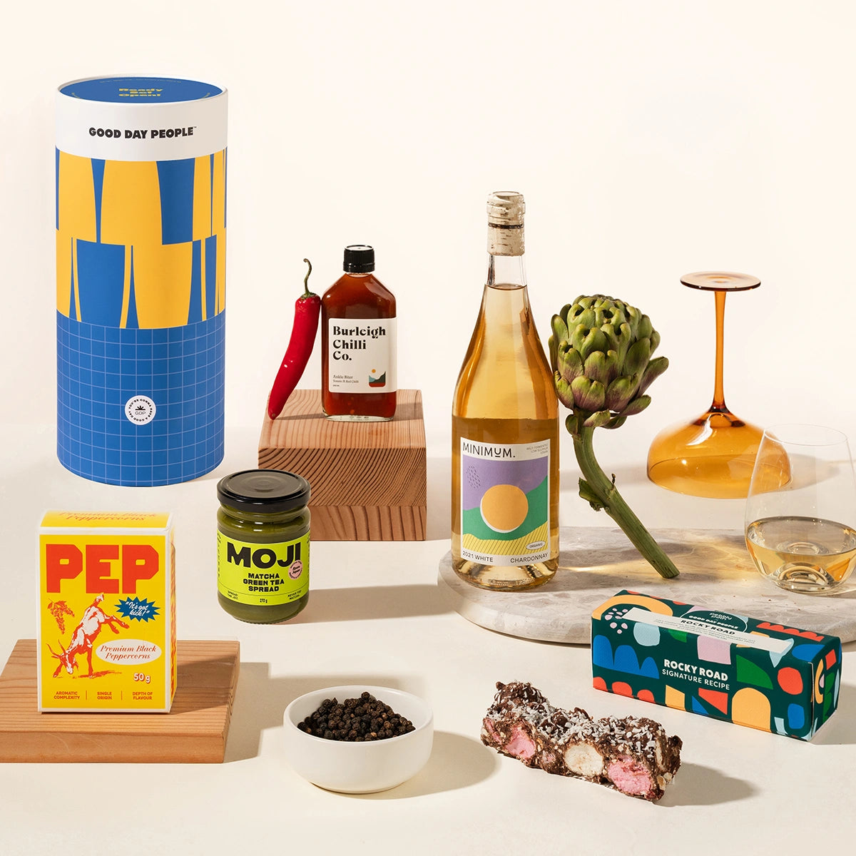 Gourmet Greg Gift Box with wine, chilli sauce, miso caramel, gourmet pepper and rocky road. Packaged in a design-forward canister.