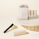 Kind Bod Clay mask set wth a brush, ceramic holder and a glass tube filled with clay mask powder