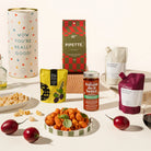 Assorted food hamper including pasta, wine, pasta sauce, olives in a beautifully designed canister. 
