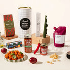 Mamma Mia gift hamper with gourmet food products such as pipette pasta, pasta sauce, italian style chilli, rocky road, wine and a sculptural candle.