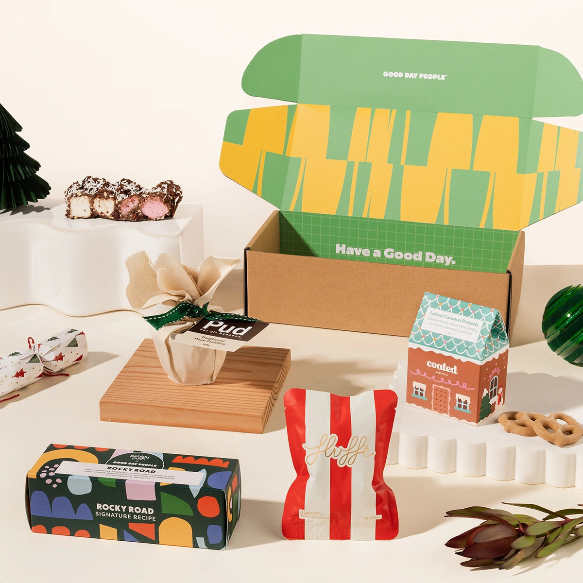 Christmas gift box with pudding, fairy floss, salted caramel pretzels and artisanal rocky road
