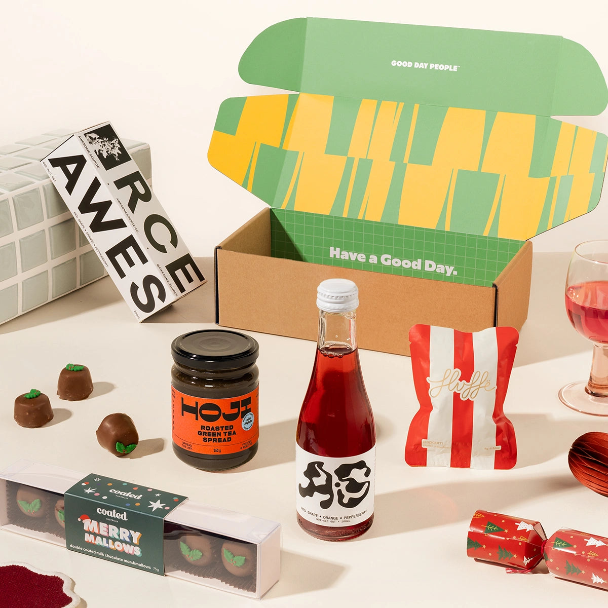 Christmas gift box with a non-alcoholic G&T, fancy fairy floss, miso caramel and chocolate coated christmas marshmallows