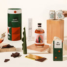 Gin and tonic inspired Christmas gift hamper, with Christmas gin from Four Pillars, 2 cans of Strangelove tonic, a sculptural pillar candle and gingerbread chocolate. Delivered in a fun, designed canister. 
