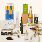 Tasteful Tim gift hamper with linen napkins, sculptural candle, wondaree macadamias, rocky road, wine and chocolate