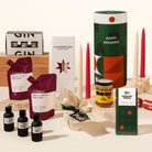Luxury Christmas gift hamper with your choice of a gin or whisky tasting flight, 2 wine pouches by A Glass Of, KOji miso caramel, christmas pudding, 4 tapered candles by maison balzac and jingle bell chocolate (gingerbread choc). 