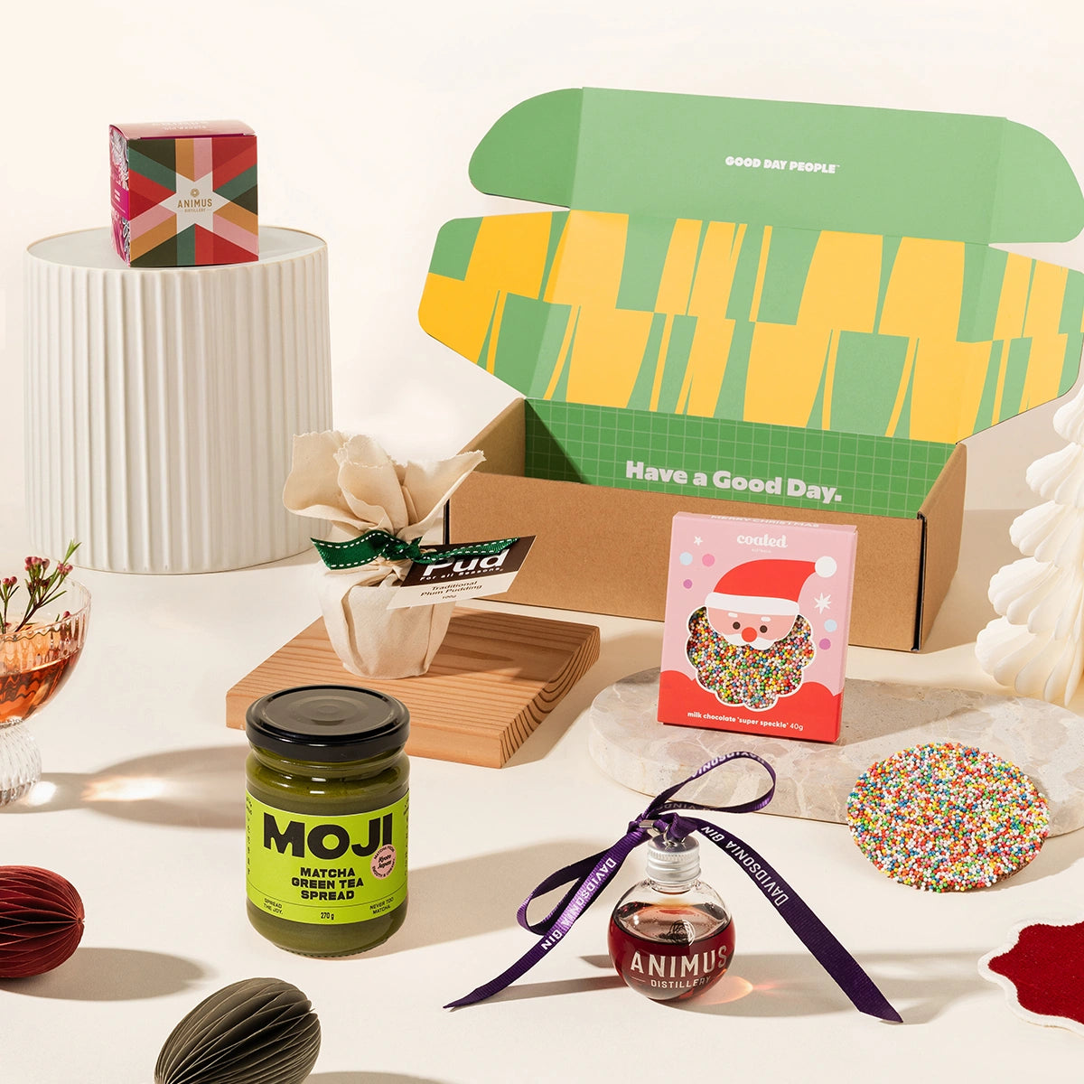 Twinkling Tina gift box with pudding, animus distillery gin bauble, speckle-coated chocolate and matcha green tea spread