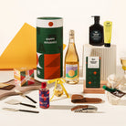 Christmas gift hamper delivered in a fun Christmas canister. Contains your choice of wine, Leif body wash & lotion set, gingerbread chocolate, a cocktail, a gin bauble, a set of 3 cheese knives, corkscrew and a Christmas pudding. 