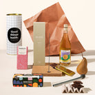 Pamper gift hamper with an incense burner kit, wine, chocolate, rocky road. Packaged in a sleek, designed canister. 
